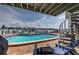 Private pool and deck area with seating and beautiful waterfront views and spiral staircase at 2515 Bay Blvd # A, Indian Rocks Beach, FL 33785