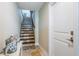 Elegant staircase with decorative tiles and wood railing, leading to upper level at 2515 Bay Blvd # A, Indian Rocks Beach, FL 33785