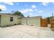 The backyard features a concrete patio and access to the back entrance and fenced yard at 2585 9Th N Ave, St Petersburg, FL 33713