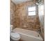 Bathroom with tiled shower and tub, offering a clean and functional space at 2585 9Th N Ave, St Petersburg, FL 33713