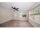 Bright living room with modern ceiling fan, beautiful wood-look flooring, and plenty of natural light at 2585 9Th N Ave, St Petersburg, FL 33713