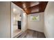 Cozy nook with wood ceiling, LVP floors, and view into adjacent kitchen at 2585 9Th N Ave, St Petersburg, FL 33713
