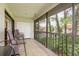 Screened balcony with chairs and community views at 2636 Enterprise E Rd # C24, Clearwater, FL 33759