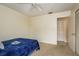 Bedroom with neutral carpet and ceiling fan at 2636 Enterprise E Rd # C24, Clearwater, FL 33759