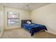 Bedroom with neutral carpet, ceiling fan, and a view of the community at 2636 Enterprise E Rd # C24, Clearwater, FL 33759
