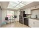 Bright kitchen featuring a bar table, stainless steel appliances, and ample natural light at 2636 Enterprise E Rd # C24, Clearwater, FL 33759