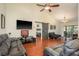 Bright living room showcasing hardwood floors, modern decor, and vaulted ceilings for a spacious feel at 2636 Enterprise E Rd # C24, Clearwater, FL 33759