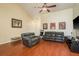 Bright living room showcasing hardwood floors, neutral walls, and comfortable seating, creating a relaxing space at 2636 Enterprise E Rd # C24, Clearwater, FL 33759