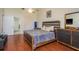 Comfortable bedroom with a modern design, ceiling fan, and wood-look flooring at 2636 Enterprise E Rd # C24, Clearwater, FL 33759