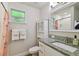 Charming bathroom featuring granite counters, ample storage, and a bright shower area with stylish accents at 2807 N Morgan St, Tampa, FL 33602