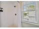 Bright bathroom featuring a tiled shower and a window with natural light at 2807 N Morgan St, Tampa, FL 33602