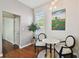 Cozy dining nook with marble-top table, stylish chairs, and natural light, with hardwood floors at 2807 N Morgan St, Tampa, FL 33602