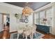 Bright dining room featuring hardwood floors and open access to the living area at 2807 N Morgan St, Tampa, FL 33602