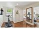 Exercise room with hardwood floors and an exercise bike next to a window at 2807 N Morgan St, Tampa, FL 33602