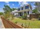 Charming two-story home with a covered front porch and fenced yard, offering curb appeal at 2807 N Morgan St, Tampa, FL 33602