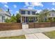 Charming two-story home with covered front porch, fenced yard, and inviting curb appeal at 2807 N Morgan St, Tampa, FL 33602