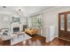 Bright living room with hardwood floors, fireplace, and large windows offering natural light at 2807 N Morgan St, Tampa, FL 33602