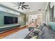 Open-concept living room featuring modern decor and lots of natural light from the backyard at 2807 N Morgan St, Tampa, FL 33602