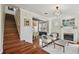 Inviting living room with hardwood floors, fireplace, and staircase to the second floor at 2807 N Morgan St, Tampa, FL 33602