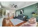 Spacious living room with views to kitchen and backyard. Features dark green walls and modern decor at 2807 N Morgan St, Tampa, FL 33602