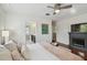 Comfortable main bedroom with hardwood floors, ensuite bath and decorative accents at 2807 N Morgan St, Tampa, FL 33602