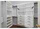 Walk-in closet with white shelving, drawers, and hanging rods for optimized storage at 2807 N Morgan St, Tampa, FL 33602