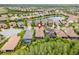 This is an aerial view of a beautiful home, landscaping, and pool, in a tranquil neighborhood with water access at 30900 Spruceberry Ct, Wesley Chapel, FL 33543