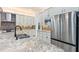 Bright kitchen featuring granite counters, stainless steel appliances, modern cabinets, and a stainless sink at 30900 Spruceberry Ct, Wesley Chapel, FL 33543