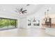 Open floor plan showing a spacious living room and modern kitchen with an island at 30900 Spruceberry Ct, Wesley Chapel, FL 33543