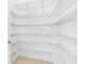 Walk-in closet with custom shelving for optimal storage and organization at 30900 Spruceberry Ct, Wesley Chapel, FL 33543