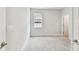 Bright bedroom featuring neutral carpet and walls with a single window at 3108 W Ballast Point Blvd, Tampa, FL 33611