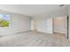 Large bedroom with plush carpeting, natural light from the window, and access to both a closet and en-suite bathroom at 3108 W Ballast Point Blvd, Tampa, FL 33611