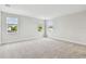 Expansive bedroom with plush carpeting, three large windows offering abundant natural light, and an inviting, comfortable feel at 3108 W Ballast Point Blvd, Tampa, FL 33611