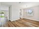 Open-concept dining room with wood flooring and backyard views at 3108 W Ballast Point Blvd, Tampa, FL 33611