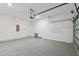 Clean and spacious garage with sealed floors, an automatic door, and ample space for storage and vehicles at 3108 W Ballast Point Blvd, Tampa, FL 33611
