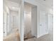 Upstairs hallway with carpet and multiple doors at 3108 W Ballast Point Blvd, Tampa, FL 33611