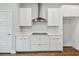 Bright kitchen features modern, white cabinetry, stainless steel appliances, and quartz countertops at 3108 W Ballast Point Blvd, Tampa, FL 33611