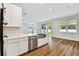 Open kitchen and living area featuring stainless steel appliances and an island with seating at 3108 W Ballast Point Blvd, Tampa, FL 33611