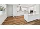 A modern kitchen featuring stainless steel appliances, white cabinets, and wood floors at 3108 W Ballast Point Blvd, Tampa, FL 33611