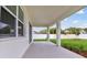 Covered patio with a view of the backyard, offering a perfect space for outdoor entertaining at 3108 W Ballast Point Blvd, Tampa, FL 33611