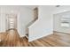 Staircase with wood floors and white walls near the entry door at 3108 W Ballast Point Blvd, Tampa, FL 33611