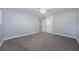 Bedroom featuring neutral carpet, ceiling fan and white trim at 3143 Mission Grove Dr, Palm Harbor, FL 34684