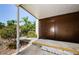 Carport storage unit with mature landscaping at 3143 Mission Grove Dr, Palm Harbor, FL 34684