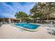 Community pool featuring lounge chairs and seating, perfect for relaxation at 3143 Mission Grove Dr, Palm Harbor, FL 34684