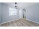 Bright dining area featuring an open layout, modern light fixture, and new floors, perfect for gatherings at 3143 Mission Grove Dr, Palm Harbor, FL 34684