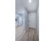 Bright entryway featuring new wood floors, leading to an open-concept space with natural light at 3143 Mission Grove Dr, Palm Harbor, FL 34684