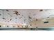 Expansive community event space with high ceilings, multiple ceiling fans and recessed lighting at 3143 Mission Grove Dr, Palm Harbor, FL 34684