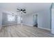 Open living space featuring new floors and modern light fixtures, creating a welcoming and stylish atmosphere at 3143 Mission Grove Dr, Palm Harbor, FL 34684