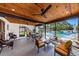 Covered patio with comfortable seating and a view of the pool at 3143 Mission Grove Dr, Palm Harbor, FL 34684