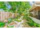 Landscaped backyard with pavers and garden at 3435 40Th N St, St Petersburg, FL 33713